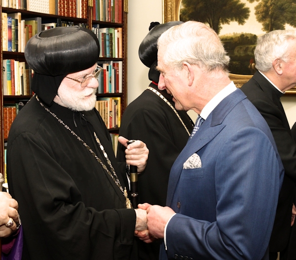 Primate of the British Orthodox Church Metropolitan Abba Seraphim shaking hands with Prince Charles.  